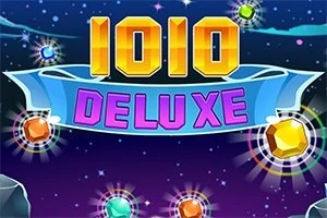Tekst i artë dhe rozë me fjalët 1010 DELUXE në një sfond me yje dhe gurë shumëngjyrësh ndriçues