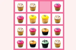 Kupcake shumëngjyrëshe të renditura në një tabelë rozë me një hapësirë bosh në katrorin e sipërm
