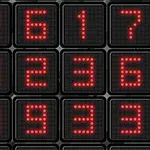 Shifra LED të kuqe në një ekran, të vendosura në një rrjet katror