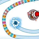 Një figurë e një personazhi të veshur si Santa që qëllon topa ngjyrash përgjatë një spiraleje bore
