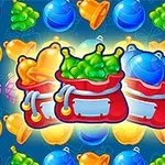 Qese të kuqe me karamele shumëngjyrëshe dhe fruta të ndryshme të ndritshme