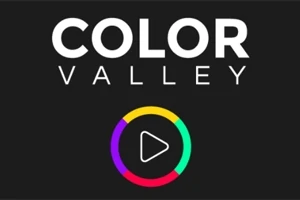 Teksti Color Valley me një rreth shumëngjyrësh që përfshin një simbol luajtjeje në qendër në sfond të zi