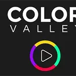 Teksti Color Valley me një rreth shumëngjyrësh që përfshin një simbol luajtjeje në qendër në sfond të zi