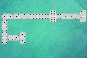 Domino të radhitura në një formë zigzag mbi një sfond të gjelbër