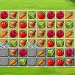 Fruta dhe perime të renditura në rreshta dhe kolona mbi një sfond të gjelbër