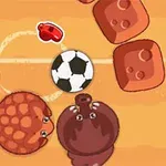 Dy kafshë të vogla, një top futbolli dhe disa blloqe të kuqe mbi një sfond portokalli