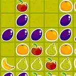 Fruta të ndryshme si qershi, kumbulla, portokalle, mollë, banane dhe dardha të vendosura në një sfond me ngjyra të ndara në katrorë