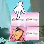 Një sfond me mure shkëmbore dhe pemë që përmban katrorë me logon Looney Tunes dhe një katror me një personazh vizatimor në qendër, me një dorë që tregon drejt tij