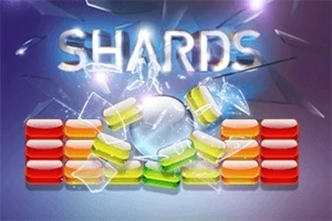 Fjala Shards e shkruar mbi copa qelqi dhe blloqe të ngjyrosura në sfond të errët