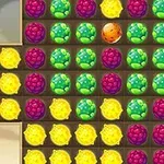 Fruta shumëngjyrëshe të renditura në një model rrjete katrore