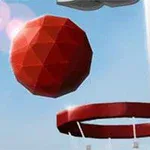 Top i kuq me shumë faqe në ajër pranë një koshi basketbolli