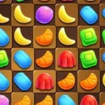 Shirita shumëngjyrëshe, banane dhe ëmbëlsira në një rrjetë kafe të errët