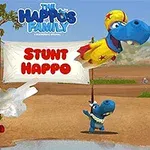 Tre karaktere blu në një peizazh natyror me një tabelë pranë tyre ku shkruhet Stunt Happo, njëri është duke u hedhur nga një top