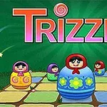 Pesë kukulla me motive tradicionale mbi një dërrasë shumëngjyrëshe me tekstin Trizzle në sfond