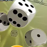 Zare të bardha me pika të zeza duke rrokullisur në një sfond jeshil